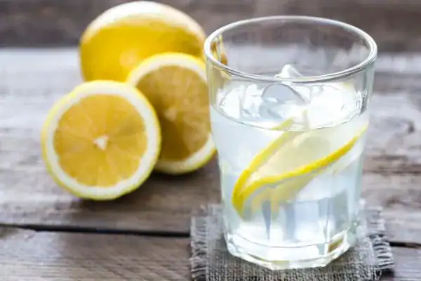 Hydration: The Secret Ingredient for a Toned Stomach and Enhanced Fitness 2 Image of lemon water to aid hydration Pinner