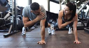 Sculpting Sleek Arms: The Essential Role of Cardio in Toning Without Bulking Up 1 Image of man and woman doing Cardio Pinner to tone their arms.